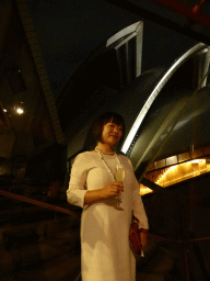 Miaomiao with a glass of wine at the Northern Foyer of the Joan Sutherland Theatre at the Sydney Opera House, with a view on the northwest side of the Sydney Opera House, by night