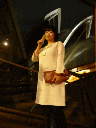 Miaomiao with a glass of wine at the Northern Foyer of the Joan Sutherland Theatre at the Sydney Opera House, with a view on the northwest side of the Sydney Opera House, by night