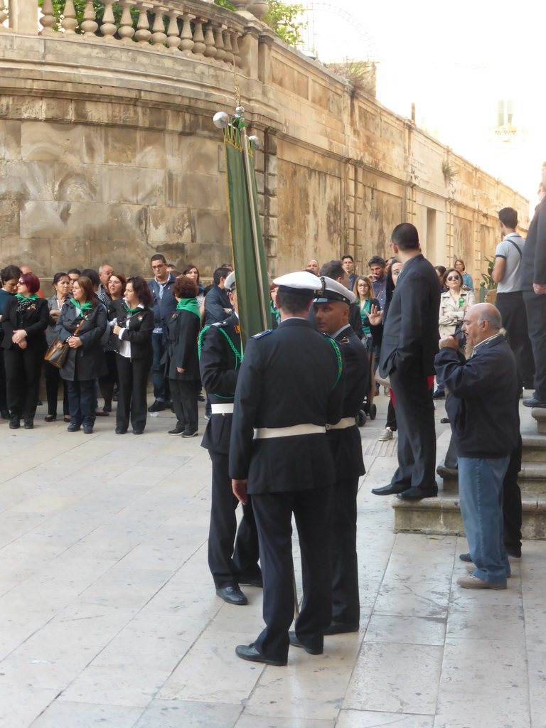 People preparing for the procession during the feast of St. Lucy in front of the Chiesa di Santa Lucia alla Badia church at the Piazza Duomo Square