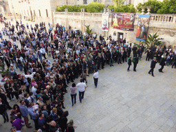 People preparing for the procession during the feast of St. Lucy in front of the Chiesa di Santa Lucia alla Badia church at the Piazza Duomo Square, viewed from the balcony of the Palazzo Borgia del Casale palace