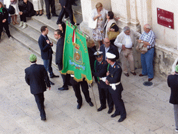 People preparing for the procession during the feast of St. Lucy in front of the Chiesa di Santa Lucia alla Badia church at the Piazza Duomo Square, viewed from the balcony of the Palazzo Borgia del Casale palace