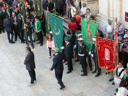 People preparing for the procession during the feast of St. Lucy in front of the Chiesa di Santa Lucia alla Badia church at the Piazza Duomo Square, viewed from the balcony of the Palazzo Borgia del Casale palace