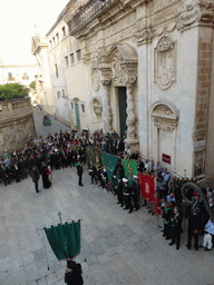 People preparing for the procession during the feast of St. Lucy in front of the Chiesa di Santa Lucia alla Badia church at the Piazza Duomo Square, viewed from the balcony of the Palazzo Borgia del Casale palace