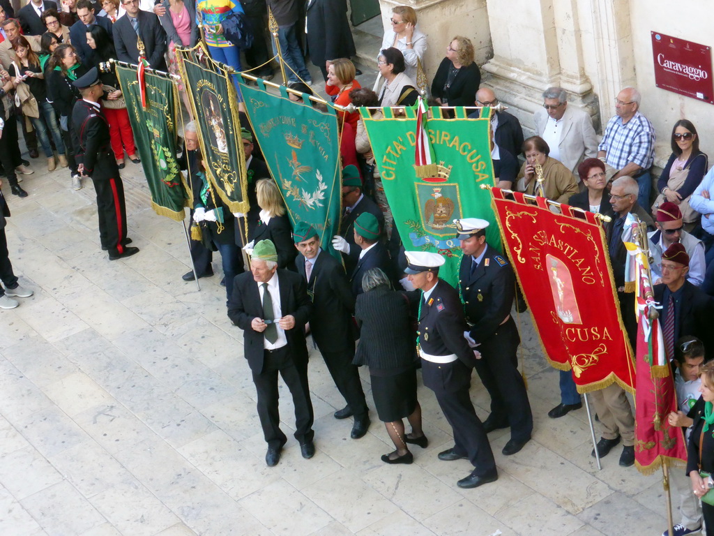 People preparing for the procession during the feast of St. Lucy in front of the Chiesa di Santa Lucia alla Badia church at the Piazza Duomo Square, viewed from the balcony of the Palazzo Borgia del Casale palace