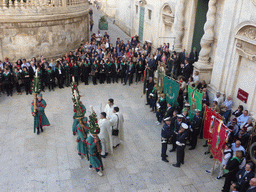 People preparing for the procession during the feast of St. Lucy in front of the Chiesa di Santa Lucia alla Badia church at the Piazza Duomo Square, viewed from the balcony of the Palazzo Borgia del Casale palace