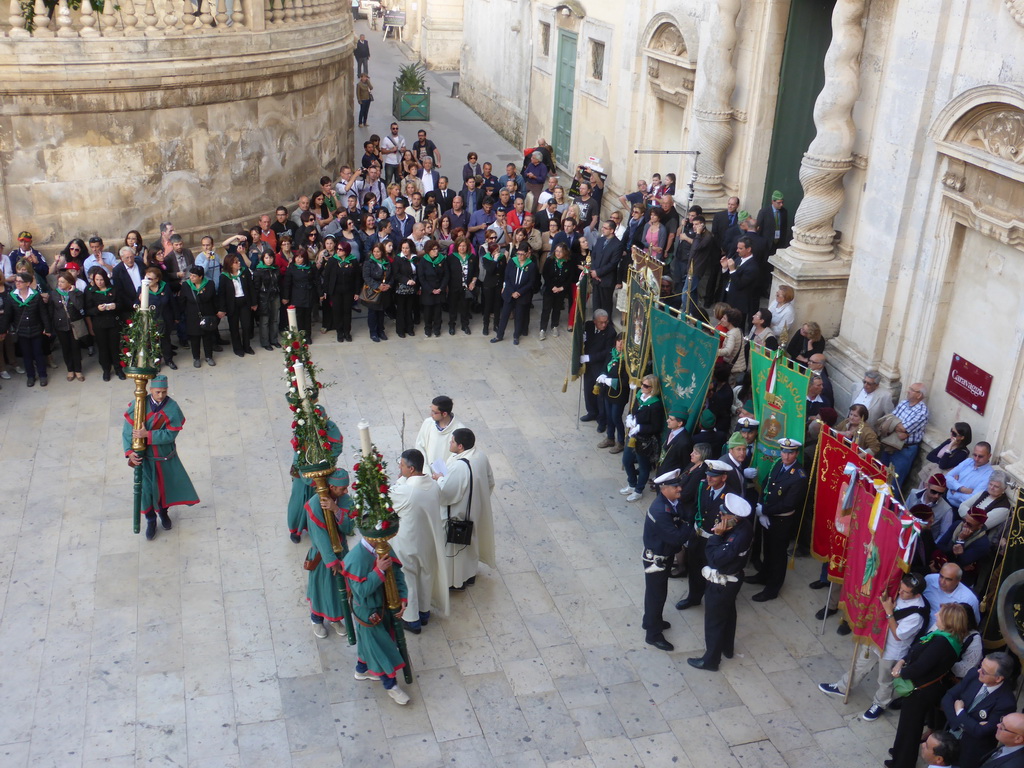 People preparing for the procession during the feast of St. Lucy in front of the Chiesa di Santa Lucia alla Badia church at the Piazza Duomo Square, viewed from the balcony of the Palazzo Borgia del Casale palace