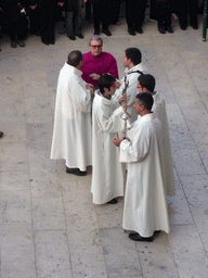 Priests preparing for the procession during the feast of St. Lucy at the Piazza Duomo Square, viewed from the balcony of the Palazzo Borgia del Casale palace