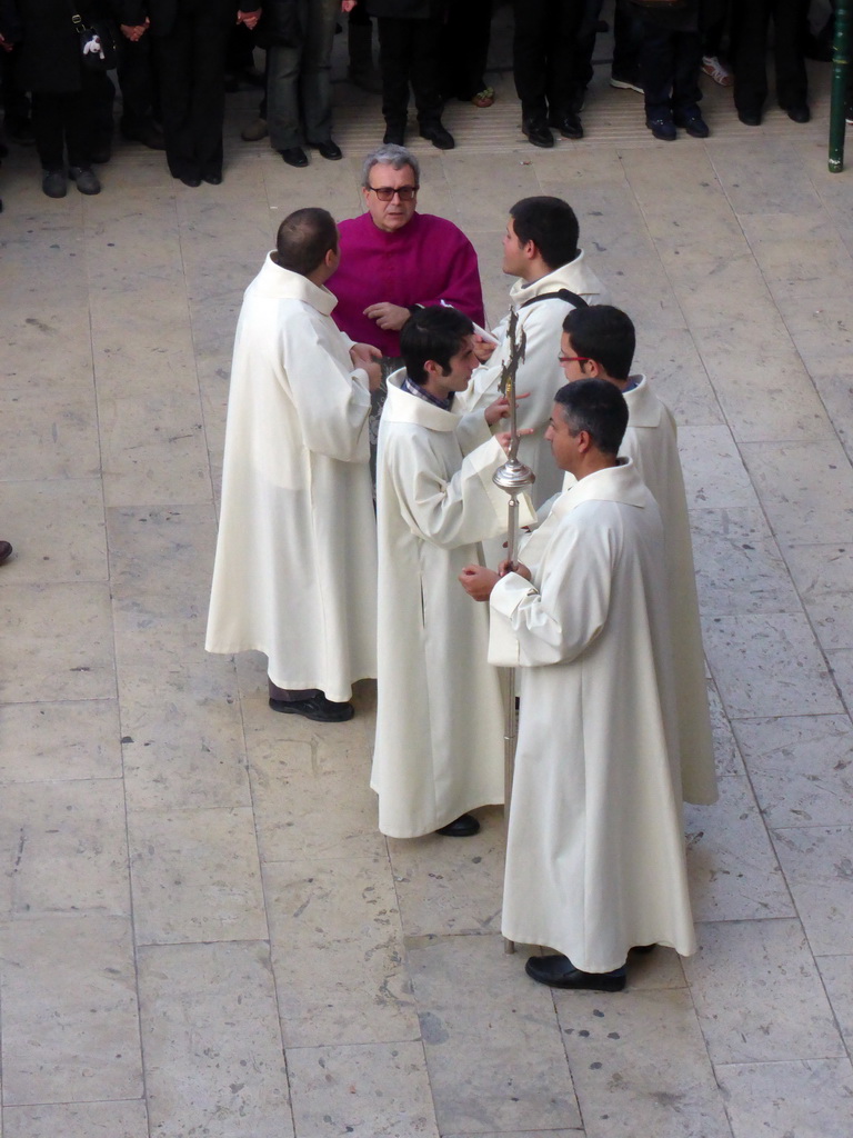 Priests preparing for the procession during the feast of St. Lucy at the Piazza Duomo Square, viewed from the balcony of the Palazzo Borgia del Casale palace