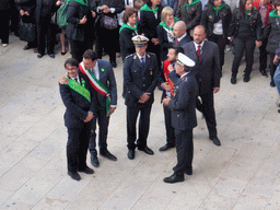 Officials preparing for the procession during the feast of St. Lucy at the Piazza Duomo Square, viewed from the balcony of the Palazzo Borgia del Casale palace