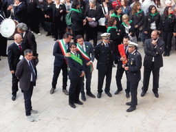 Officials preparing for the procession during the feast of St. Lucy at the Piazza Duomo Square, viewed from the balcony of the Palazzo Borgia del Casale palace