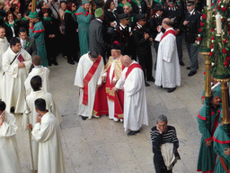 Priests preparing for the procession during the feast of St. Lucy at the Piazza Duomo Square, viewed from the balcony of the Palazzo Borgia del Casale palace