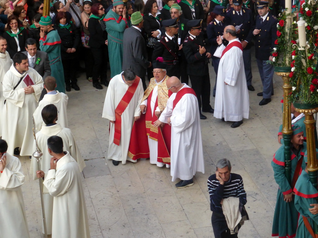 Priests preparing for the procession during the feast of St. Lucy at the Piazza Duomo Square, viewed from the balcony of the Palazzo Borgia del Casale palace