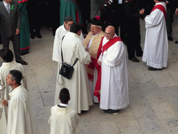 Priests preparing for the procession during the feast of St. Lucy at the Piazza Duomo Square, viewed from the balcony of the Palazzo Borgia del Casale palace