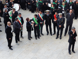 Officials preparing for the procession during the feast of St. Lucy at the Piazza Duomo Square, viewed from the balcony of the Palazzo Borgia del Casale palace