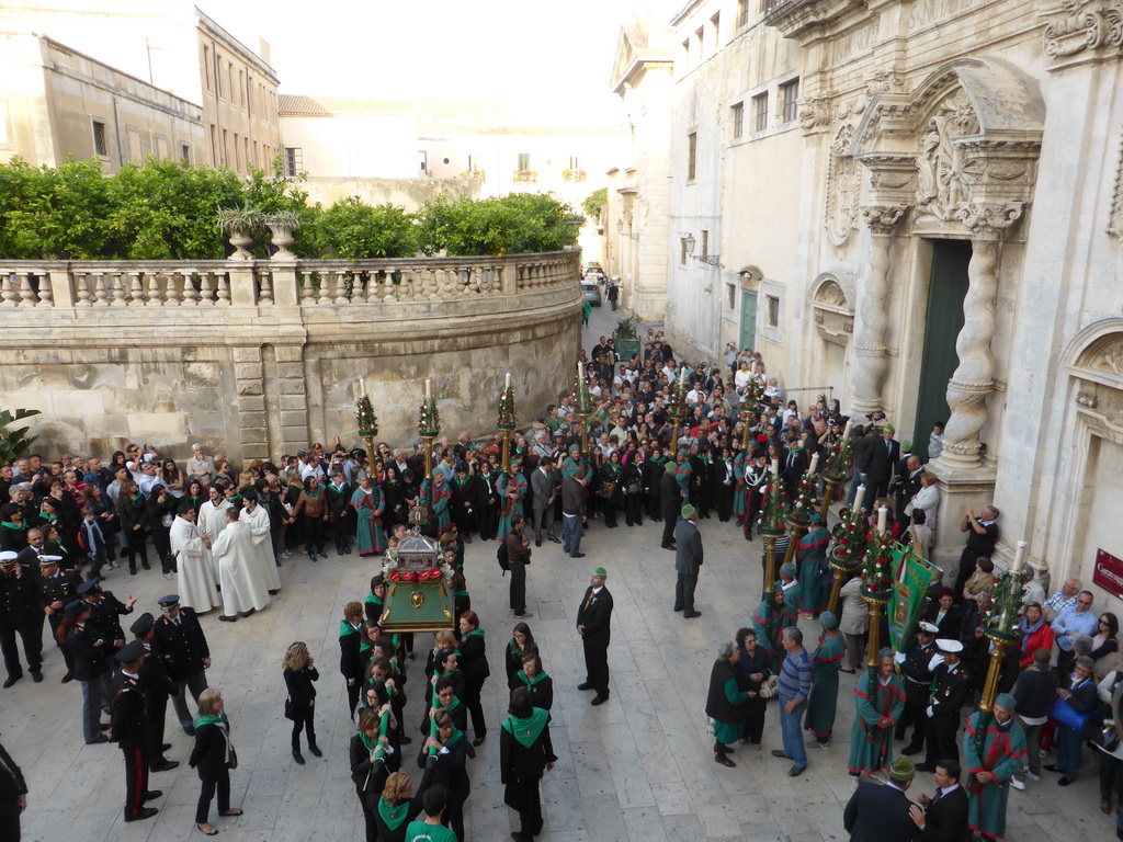 Relics of St. Lucy carried around in the procession during the feast of St. Lucy in front of the Chiesa di Santa Lucia alla Badia church at the Piazza Duomo Square, viewed from the balcony of the Palazzo Borgia del Casale palace