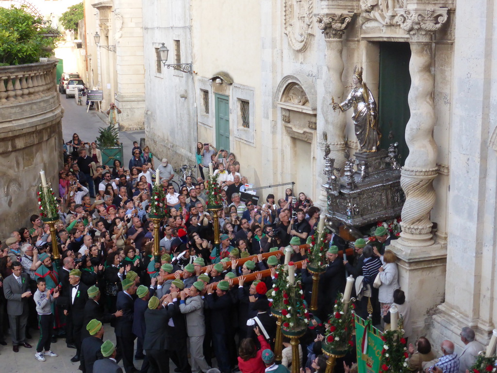 Statue of St. Lucy carried out of the Chiesa di Santa Lucia alla Badia church at the Piazza Duomo Square during the feast of St. Lucy, viewed from the balcony of the Palazzo Borgia del Casale palace