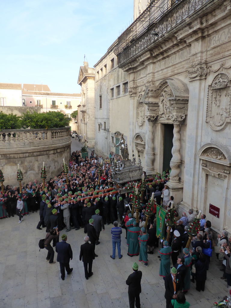 Statue of St. Lucy carried out of the Chiesa di Santa Lucia alla Badia church at the Piazza Duomo Square during the feast of St. Lucy, viewed from the balcony of the Palazzo Borgia del Casale palace