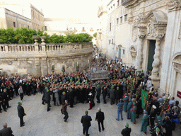 Statue of St. Lucy carried around in the procession during the feast of St. Lucy in front of the Chiesa di Santa Lucia alla Badia church at the Piazza Duomo Square, viewed from the balcony of the Palazzo Borgia del Casale palace