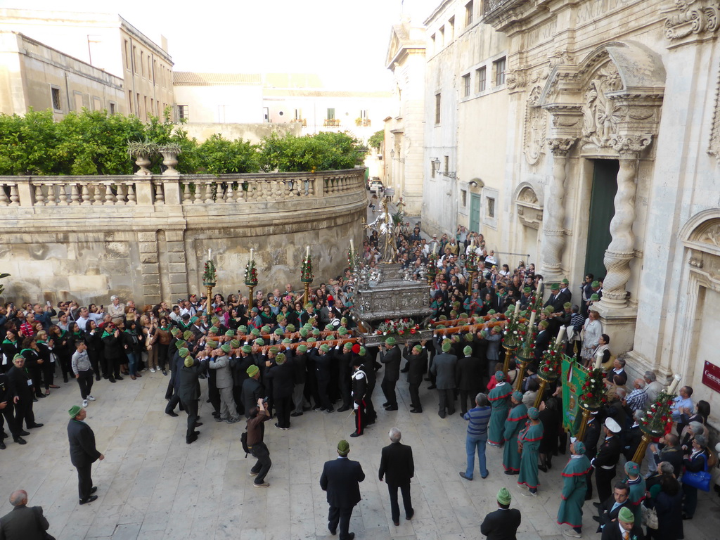 Statue of St. Lucy carried around in the procession during the feast of St. Lucy in front of the Chiesa di Santa Lucia alla Badia church at the Piazza Duomo Square, viewed from the balcony of the Palazzo Borgia del Casale palace