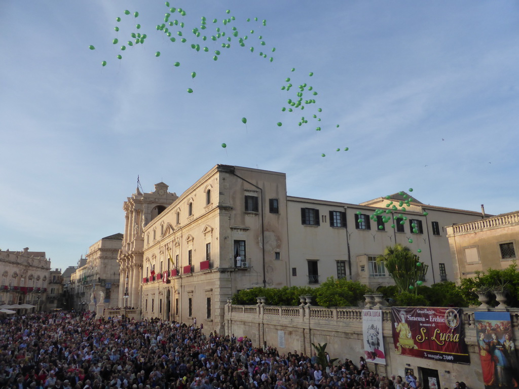 Balloons being released from the Archbisshop`s See at the Piazza Duomo Square during the feast of St. Lucy, viewed from the balcony of the Palazzo Borgia del Casale palace