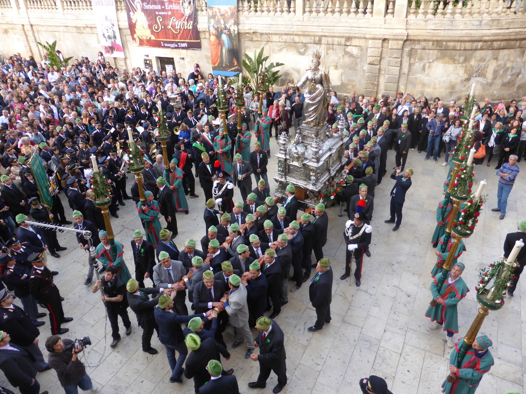 Statue of St. Lucy carried around in the procession during the feast of St. Lucy at the Piazza Duomo Square, viewed from the balcony of the Palazzo Borgia del Casale palace