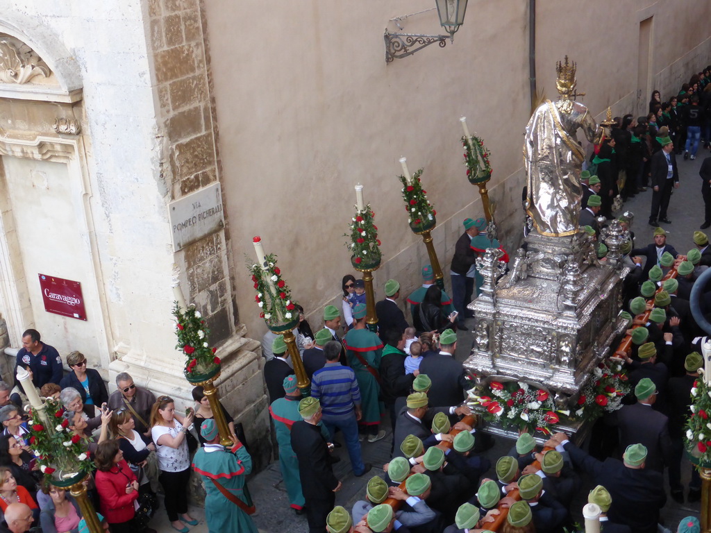 Statue of St. Lucy carried around in the procession during the feast of St. Lucy at the Via Pompeo Picherali street, viewed from the balcony of the Palazzo Borgia del Casale palace