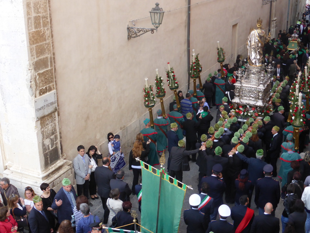 Relics and statue of St. Lucy carried around in the procession during the feast of St. Lucy at the Via Pompeo Picherali street, viewed from the balcony of the Palazzo Borgia del Casale palace