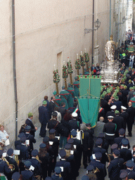 Relics and statue of St. Lucy carried around in the procession during the feast of St. Lucy at the Via Pompeo Picherali street, viewed from the balcony of the Palazzo Borgia del Casale palace