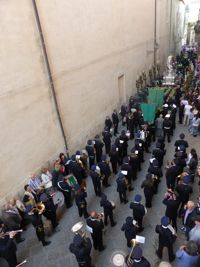 Relics and statue of St. Lucy carried around in the procession during the feast of St. Lucy at the Via Pompeo Picherali street, viewed from the balcony of the Palazzo Borgia del Casale palace