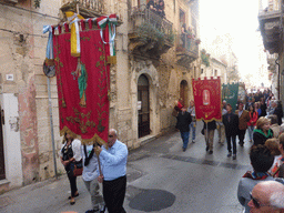 People carrying banners at the procession during the feast of St. Lucy at the Via Castello Maniace street