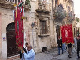 People carrying banners at the procession during the feast of St. Lucy at the Via Castello Maniace street