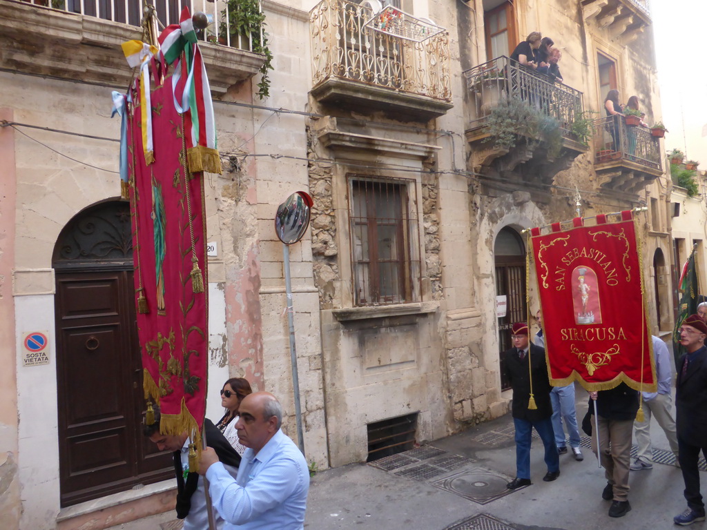 People carrying banners at the procession during the feast of St. Lucy at the Via Castello Maniace street