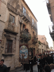 People carrying banners at the procession during the feast of St. Lucy at the Via Castello Maniace street