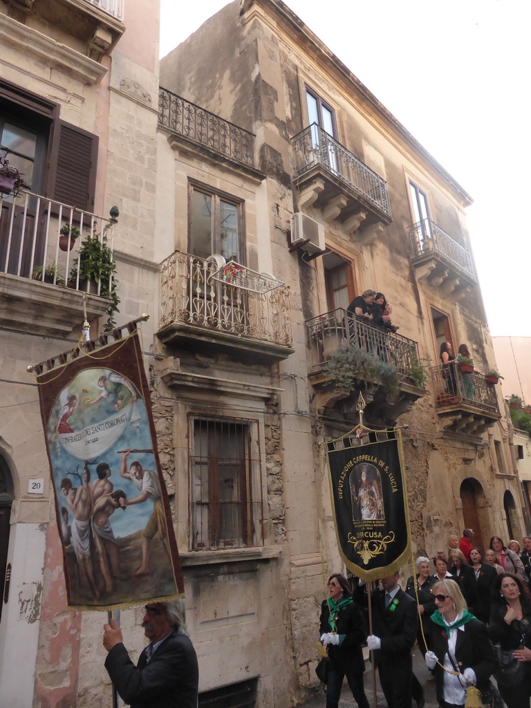 People carrying banners at the procession during the feast of St. Lucy at the Via Castello Maniace street