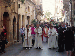 Priests and the relics and statue of St. Lucy carried around in the procession during the feast of St. Lucy at the Via Castello Maniace street