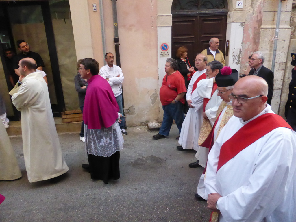 Priests in the procession during the feast of St. Lucy at the Via Castello Maniace street