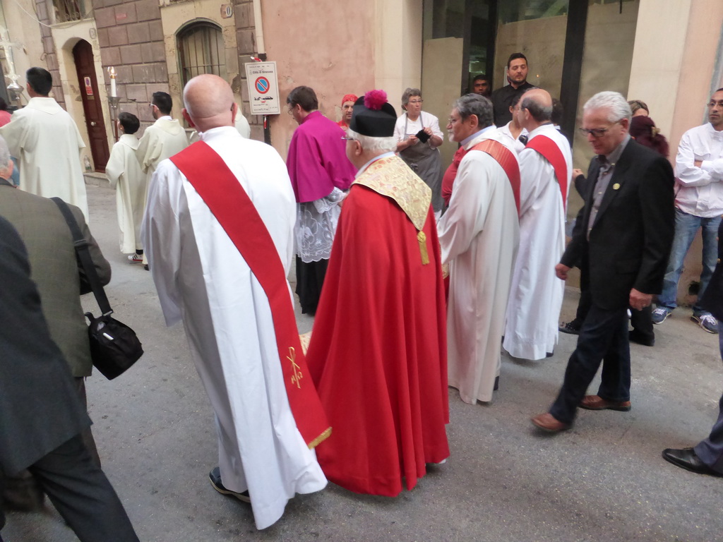 Priests in the procession during the feast of St. Lucy at the Via Castello Maniace street