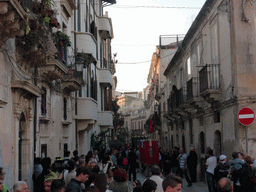 People carrying banners and the statue of St. Lucy at the procession during the feast of St. Lucy at the Via Castello Maniace street, viewed from the Lungomare Alfeo street
