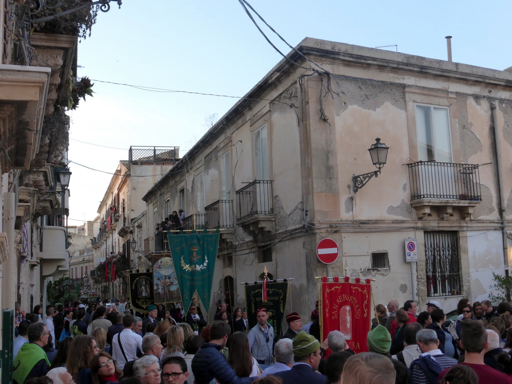 People carrying banners and the statue of St. Lucy at the procession during the feast of St. Lucy at the Via Castello Maniace street, viewed from the Lungomare Alfeo street