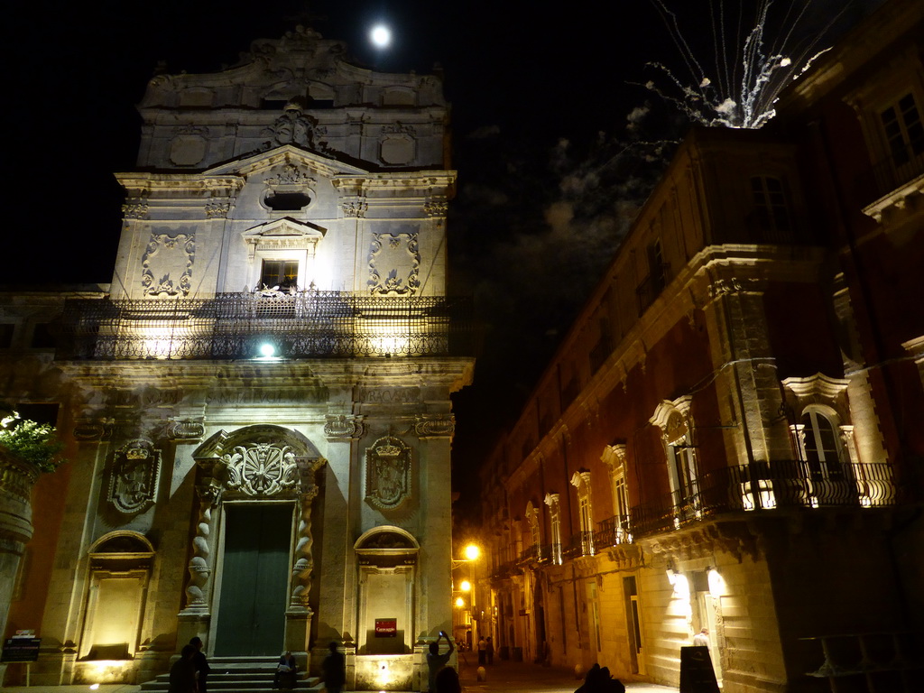 Fireworks during the feast of St. Lucy at the Chiesa di Santa Lucia alla Badia church and the Palazzo Borgia del Casale palace at the Piazza Duomo Square, by night