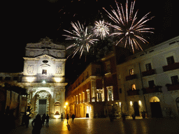 Fireworks during the feast of St. Lucy at the Chiesa di Santa Lucia alla Badia church and the Palazzo Borgia del Casale palace at the Piazza Duomo Square, by night