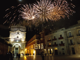 Fireworks during the feast of St. Lucy at the Chiesa di Santa Lucia alla Badia church and the Palazzo Borgia del Casale palace at the Piazza Duomo Square, by night