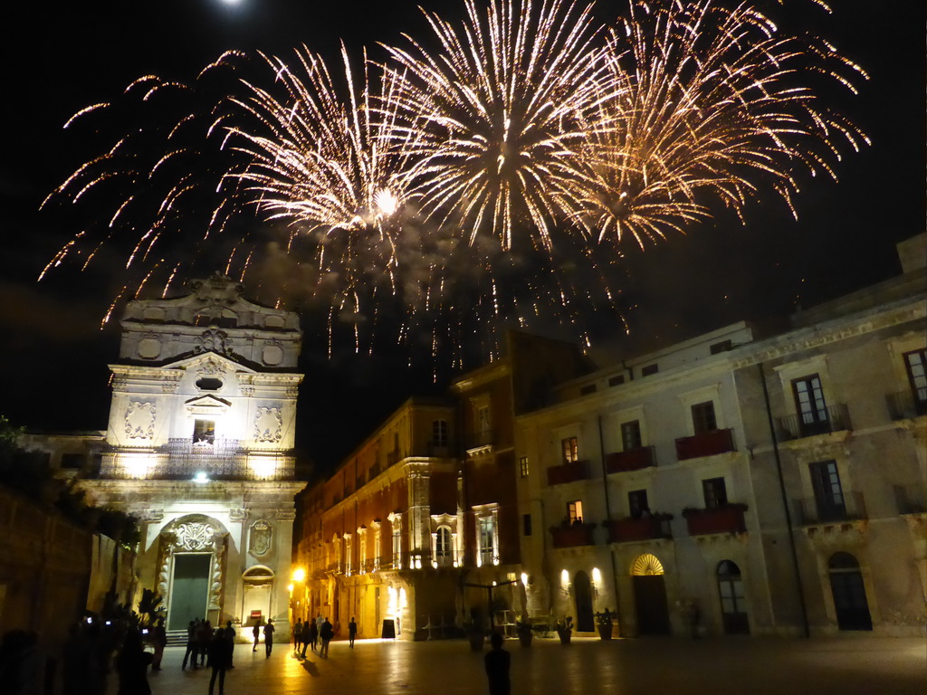 Fireworks during the feast of St. Lucy at the Chiesa di Santa Lucia alla Badia church and the Palazzo Borgia del Casale palace at the Piazza Duomo Square, by night