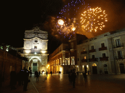 Fireworks during the feast of St. Lucy at the Chiesa di Santa Lucia alla Badia church and the Palazzo Borgia del Casale palace at the Piazza Duomo Square, by night
