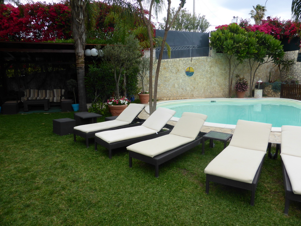 Sun chairs in the garden of the Hotel Villamare at the village of Fontane Bianche