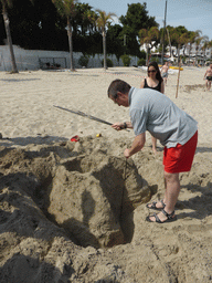 Course leader with our letter `A` in the sand at the Lido Sayonara beach at the village of Fontane Bianche