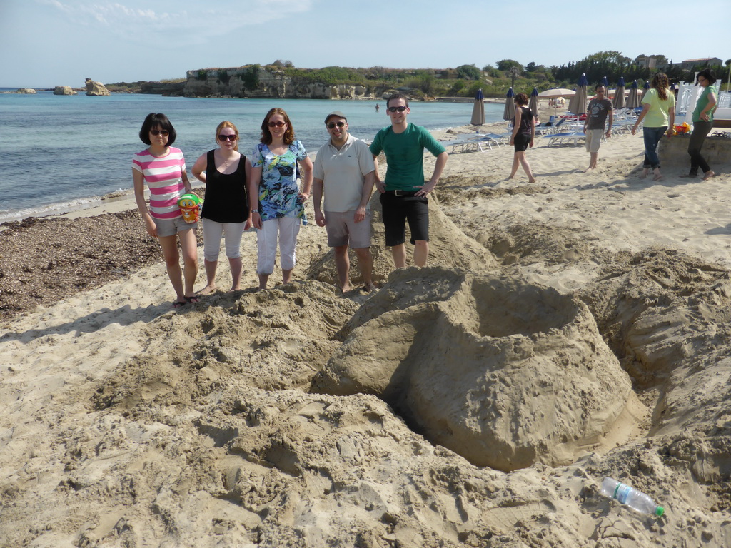 One of the teams with the letter `R` in the sand at the Lido Sayonara beach at the village of Fontane Bianche