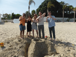 Tim and his team with the letter `A` in the sand at the Lido Sayonara beach at the village of Fontane Bianche