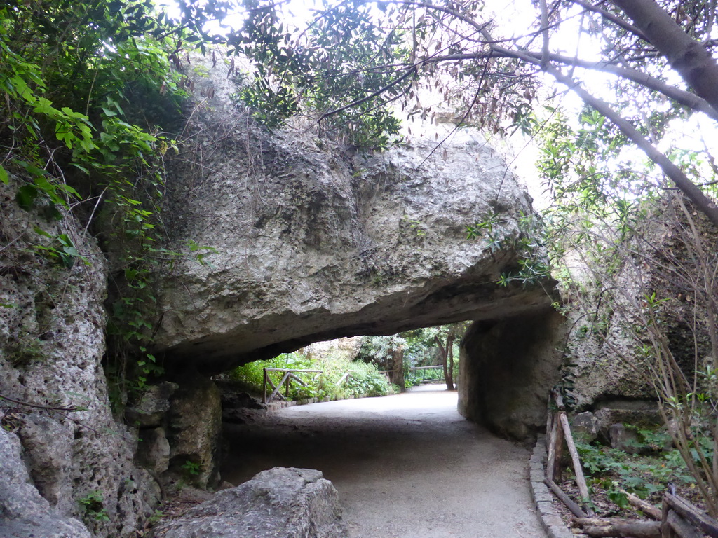 Rock hanging over the path at the Latomia del Paradiso quarry at the Parco Archeologico della Neapolis park