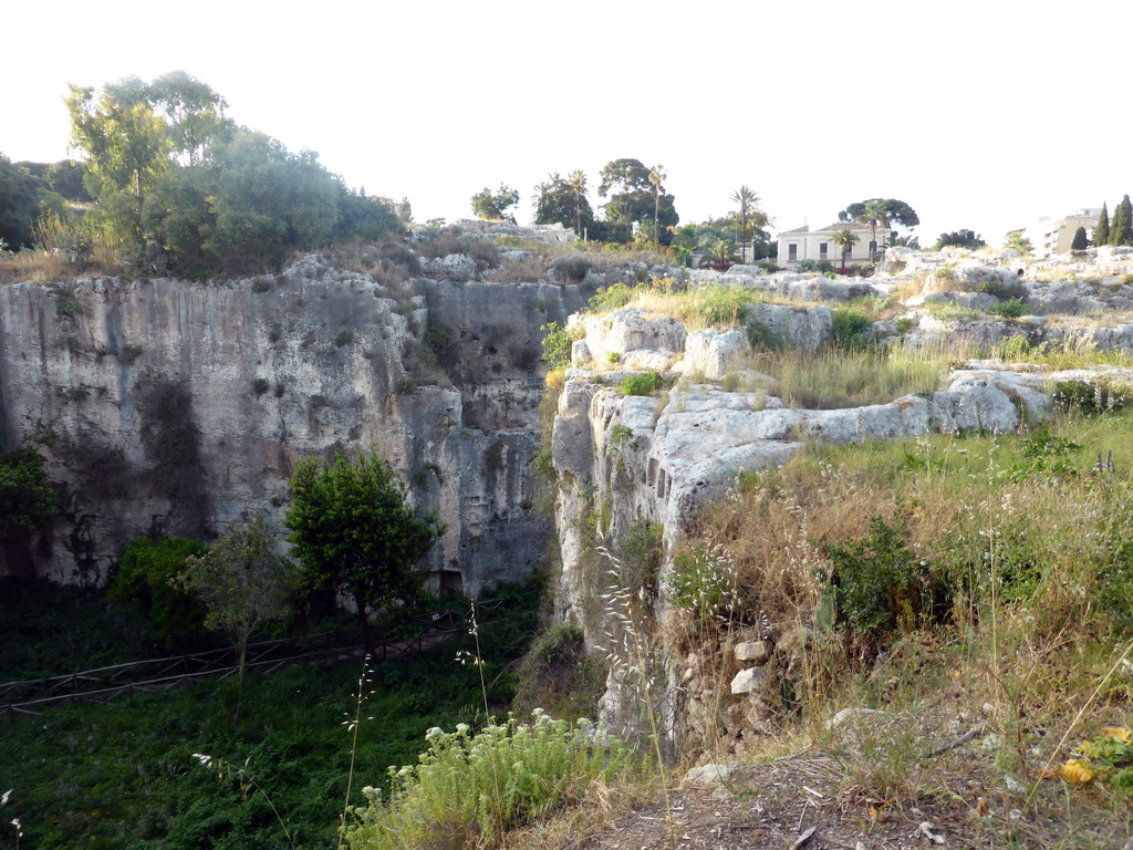 East side of the Latomia del Paradiso quarry at the Parco Archeologico della Neapolis park, viewed from the Via Ettore Romagnoli street